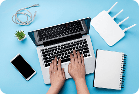 Laptop workspace with broadband equipment
